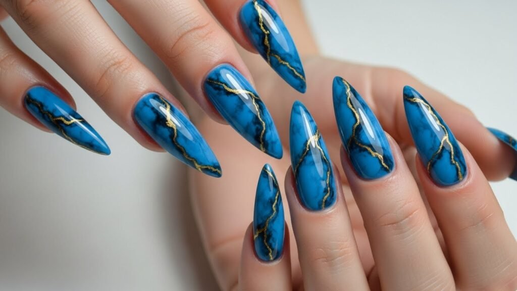 Blue Marble Stiletto Nails with Gold Veins