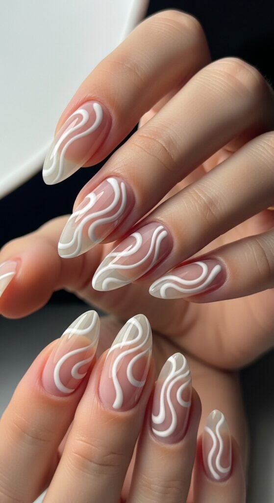 Elegant White Swirl Almond Nails